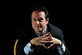 Comedian Mark Thomas, on stage in Sheffield