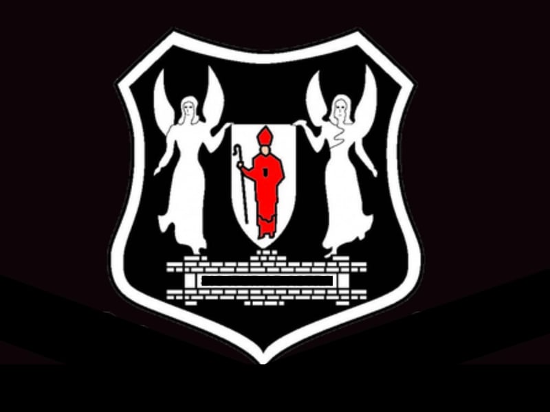 Black and white, with a hint of red for this League Two side.