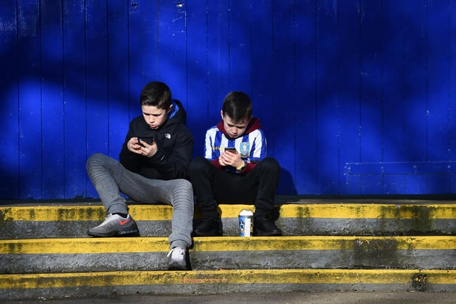 Two young Wednesdayites wait to enter Hillsborough for the Millwall game last February.