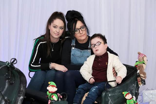 Lisa Lax-Harding (centre) with her son Finlay, now 4, and wife Abbie (left). As the facilities manager at a rehabilitation centre, Lisa is having to isolate from her disabled son for weeks at a time, and has said she fears she may never see him again if she catches coronavirus. PA Photo.