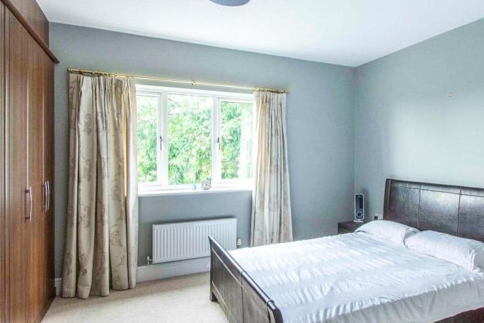 Double bedroom - with a rear facing double glazed window. There is a central heating radiator and fitted wardrobes.