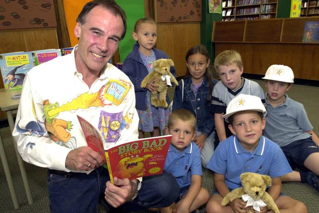 Pictured at the Manor  Library, Ridgeway Road, Sheffield, where children's author Denis Bond was reading to children from his book, as part of the Powergen Sponsored Reading event. Seen is Denis with, sisters Bethany and Mikaela Hayes, brothers Kane and Ronan Drury, and twins Stephen and Adam Chambers, August 2002