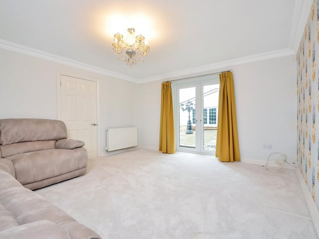 This huge five-bedroom Portsdown Hill home in Portsmouth is up for raffle. Pictured is the living room in the annex.