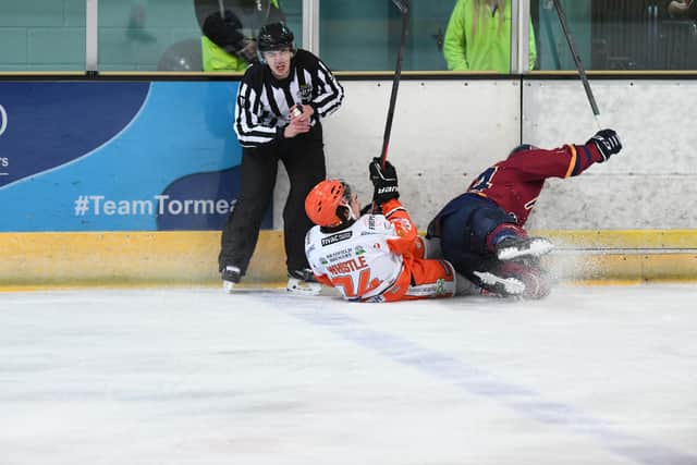 Sheffield Steelers' Brandon Whistle and an official come a cropper at Guildford