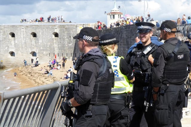 Police at the Hot Walls in Old Portsmouth as people watched HMS Queen Elizabeth arriving back into Portsmouth. Picture: Karina Hill