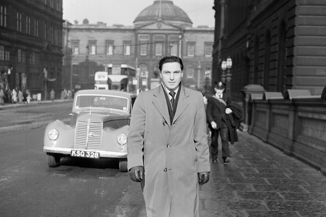 Footballer Bobby Johnstone walking over North Bridge on his way to sign a contract to join Manchester City in March 1955.