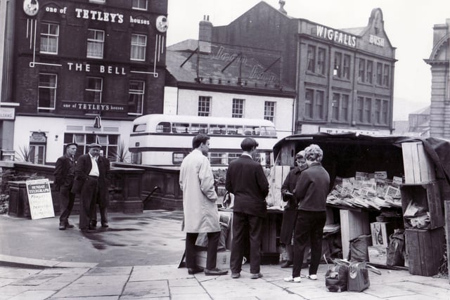 The scene in Fitzalan Square, Sheffield, on a Sunday morning, as casual passers-by stop for the Sunday morning papers in the quiet of the city centre, July 18, 1965
The Bell public house and Wigfalls can be seen in the background