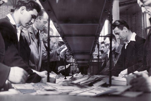 Postal workers sorting the letters into bundles, with the stamps at the top ready for franking, in September 1949