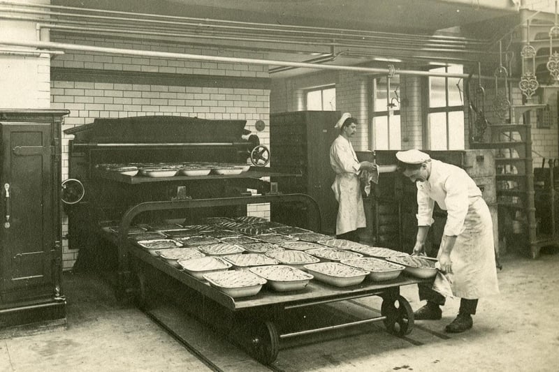 Unloading the meat or fish pies at Sheffield Central Cooking Depot in the 1910s. Ref no: t08217