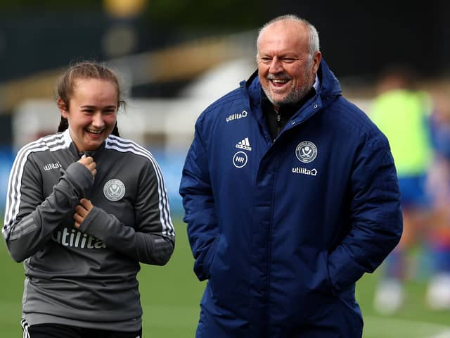 Neil Redfearn, manager of Sheffield United speaks with Blades forward Lucy Watson (photo by Jacques Feeney - The FA/The FA via Getty Images).