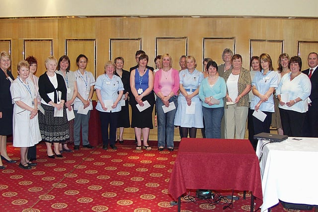 Rotherham Hospital staff who undertook a BTEC Intermediate Infection Control Course in 2006. Students at an awards ceremony with NHS Trust chair Margaret Oldfield, far left, and Trust chief executive Brian James, far right