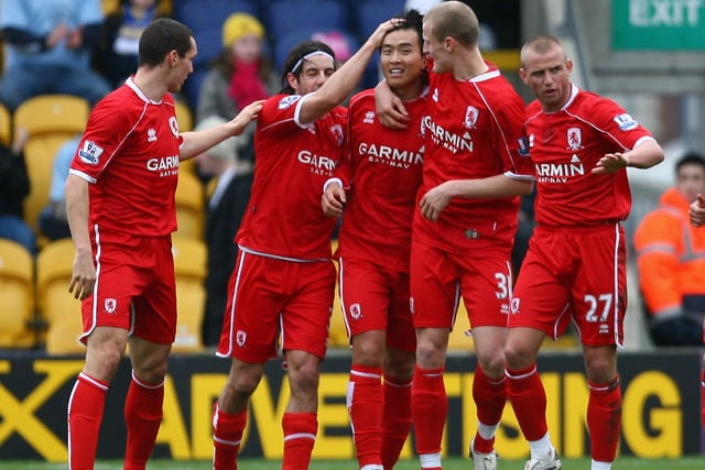 Dong Gook Lee celebrates with team mates after scoring the opening goal.