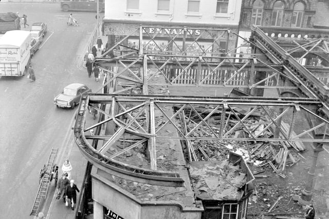 Demolition work at Sunderland Central Station masks this view of Lennards shoe shop in 1966.