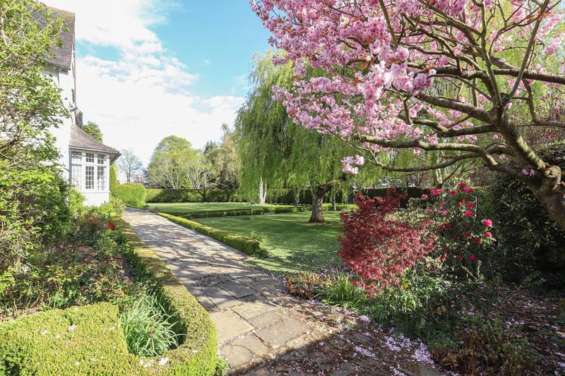 Landscaped grounds surround the property, providing a sense of seclusion and privacy from neighbouring houses.