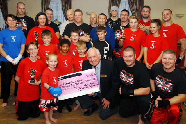 In 2011 four-year-old Leo Dove handed over the proceeds of the Wragsters Kick Boxing Club's fundraiser totalling £1,200 to Brian George, chairman of the John Eastwood Hospice Trust