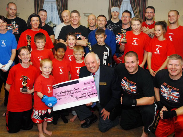 In 2011 four-year-old Leo Dove handed over the proceeds of the Wragsters Kick Boxing Club's fundraiser totalling £1,200 to Brian George, chairman of the John Eastwood Hospice Trust