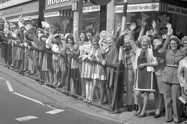 Staff from Books Fashions were practising their wave for the Cup parade in this 1973 scene.