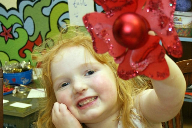 Rosabella Orrell, 3, with her creation at a Victorian Valentine crafts session in  Courtyard Arts, Belper, in 2009.