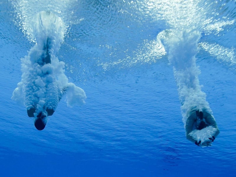 Eden Cheng and Lois Toulson of Great Britain compete during the women's synchronised 10-meter platform final at the 2020 Summer Olympics, Monday, July 26, 2021, in Tokyo, Japan.