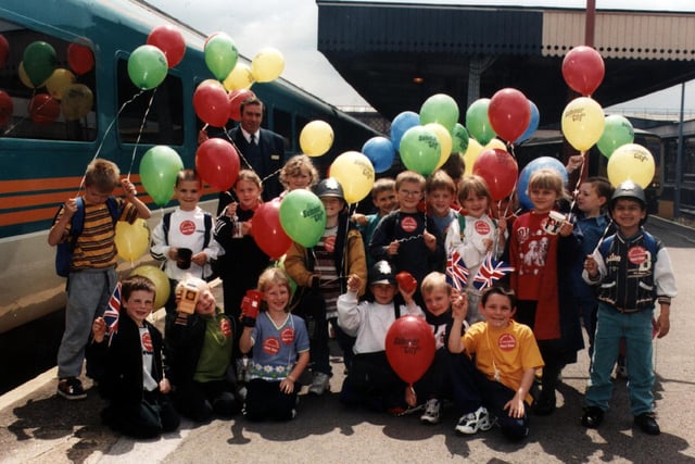 Pupils from Wincobank Nursery Infant School celebrate Midland's mainline summer promotion at Sheffield station in 1998