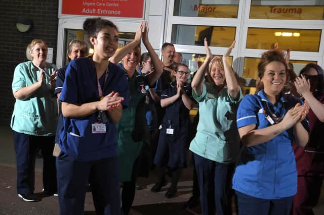 Hospital staff join in with the clap for carers during the pandemic