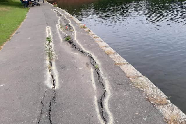 The sunken surface of the path around Crookes Valley Lake, in Crookesmoor, Sheffield