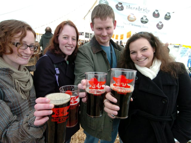 Grace Corbett, Davina Craps, Brent Guffrey and Sarah Hope enjoy a pint at the 34th Steel City Beer Festival at Cemetery Park in October 2008