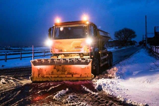 A gritter in snowy conditions near Snowden Hill in Sheffield - Credit: Danny Lawson/PA Wire
