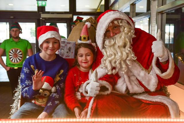 Santa's big arrival in the Middleton Grange Shopping Centre n 2017. Here he is on his sleigh with PJ Foster (10) and Lacey Foster (6).