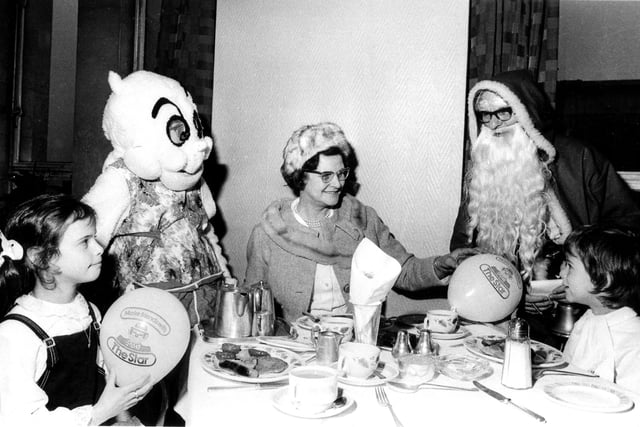 Gloops had breakfast in Cockayne's Department Store restaurant with Father Christmas and young shoppers in the store.  Our picture shows 7-year-old twins Nicholas and Caroline Bush of Lodge Moor with their grandmother Nettie Curtis in December 1972