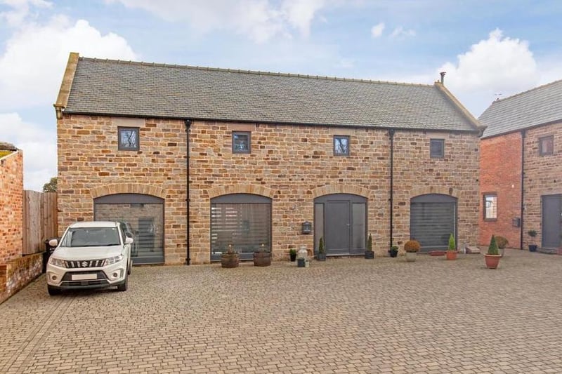 The property is described as a secluded, exclusive gated farmyard redevelopment with private parking.
