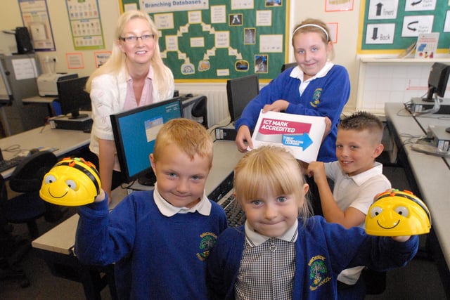 ICT teacher Tina Stephenson is pictured with pupils at Simonside Primary School after it won an ICT mark in 2011.