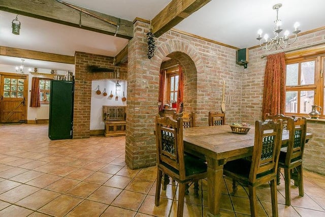 A cute breakfast/dining area, just off the kitchen. Nearby is a utility or laundry room too, plus a downstairs WC with cloakroom.