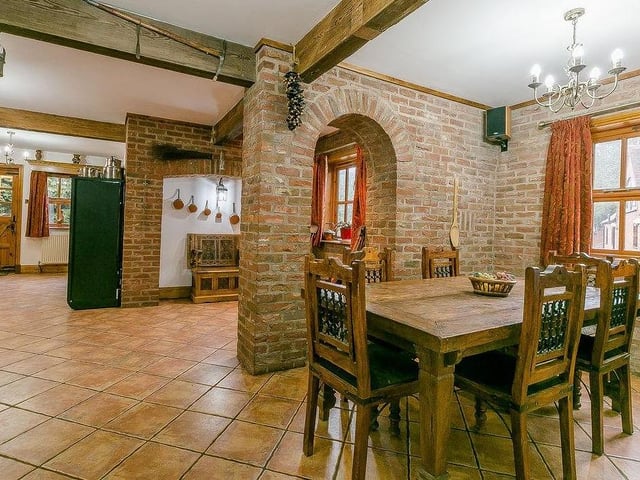 A cute breakfast/dining area, just off the kitchen. Nearby is a utility or laundry room too, plus a downstairs WC with cloakroom.