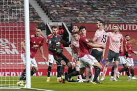 Kean Bryan opened the scoring for United at Old Trafford: Andrew Yates/Sportimage