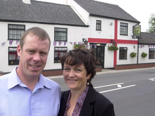 Pictured at the Horse and Groom Pub, Nutwell Lane, Armthorpe, Doncaster in 2002. Seen is Landlord and Lady Dave and Heather Watson who are supporting the England Football team, by painting the front of the pub