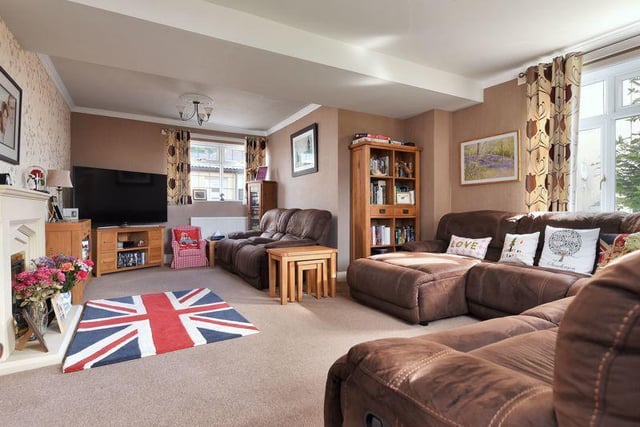 The home's large sitting room looks cosy and comfortable.