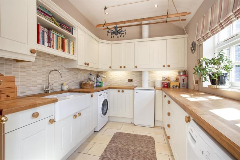 The property features a side entrance with utility area, boot room, downstairs WC and access to a further bedroom, or 'fantastic' work-from-home space.