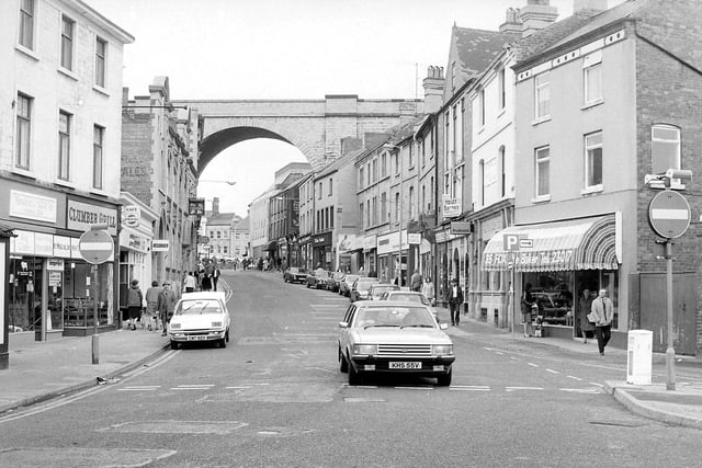 A bustling Church Street, with the famous viaduct in the background