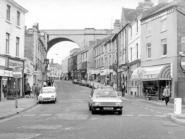 A bustling Church Street, with the famous viaduct in the background
