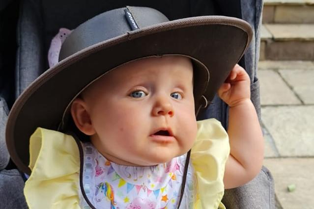 This little lady is keeping cool with a cowboy hat.