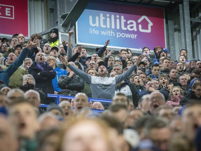 Pompey fans keeping their spirits up even after going 2-0 down.