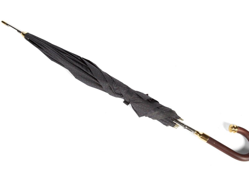 A replica of the type of umbrella believed to have been used to carry out the infamous assassination of Bulgarian author Georgie Markov. Estimate: $3,000-$5,000.
