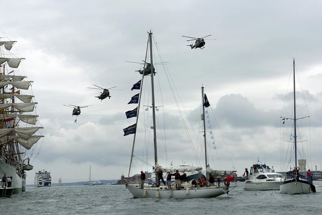 International Festival Of The Sea (IFOS) in the Naval Dockyard , today was the last day of the 4 day festival 3rd July 2005
Sail 8  boats return from france without any protestors
with the helicopter fly past overhead
Picture Paul Jacobs 053124-4