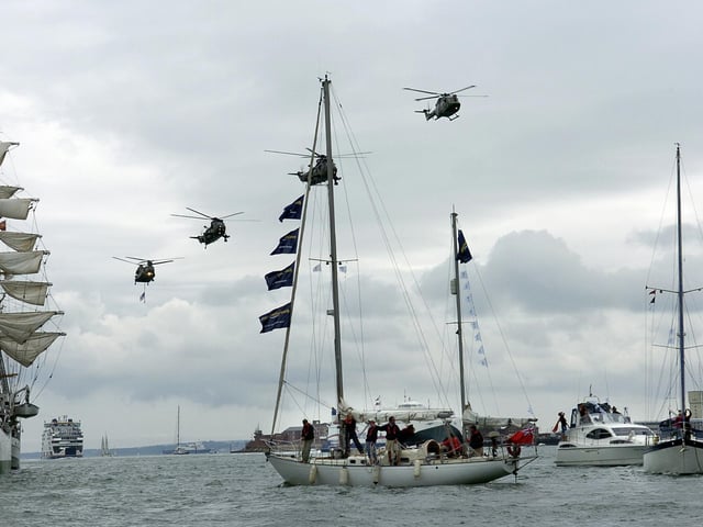 International Festival Of The Sea (IFOS) in the Naval Dockyard , today was the last day of the 4 day festival 3rd July 2005
Sail 8 boats return from france without any protestors
with the helicopter fly past overhead
Picture Paul Jacobs 053124-4