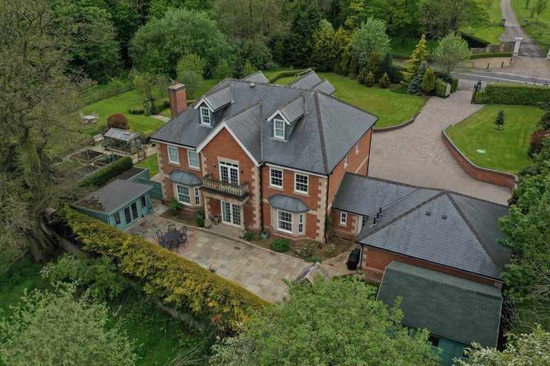 The property boasts a rear seating terrace, as well as a range of outbuildings, including a garden room, summerhouse and integral double garage,