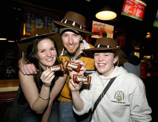 Sheffield will be celebrating Australia Day this year by joining a world record attempt on the Tim Tam Slam to be staged at Walkabout, Carver Street.  Locals will be among the 30,000 people across the country to simultaneously dunk and suck the renowned Australian biscuit. Pictured are Angeline Bicker, Jamie Davidson, Katie Vaines in 2004