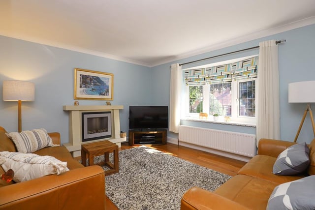 The cosy sitting room is one  of two reception rooms and is separate from the living room.