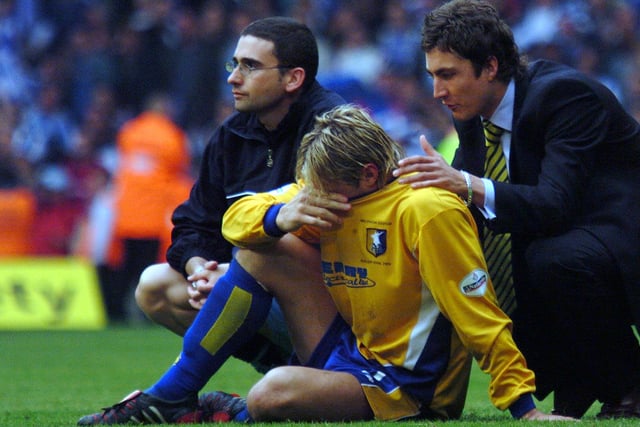 Liam Lawrence is inconsolable after the play-off final defeat.