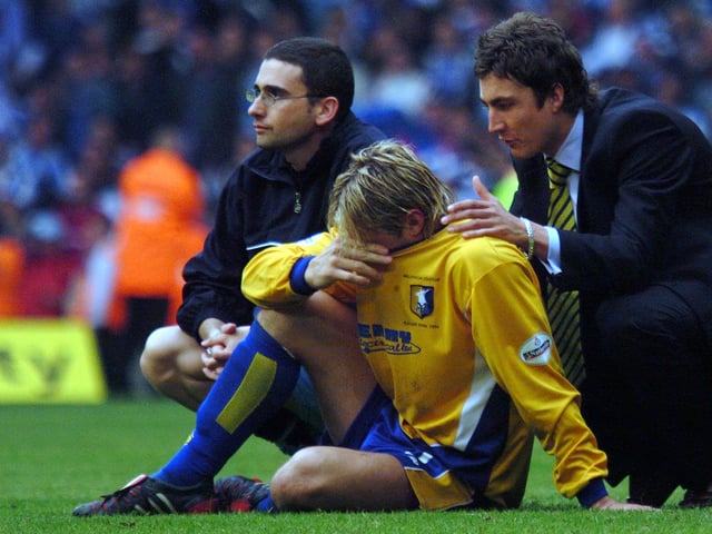Liam Lawrence is inconsolable after the play-off final defeat.